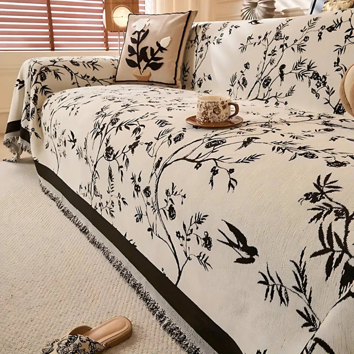 Elegante coperta con motivo floreale e frange