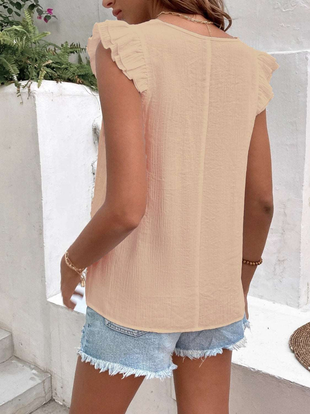 Blouse with gathered V-neckline