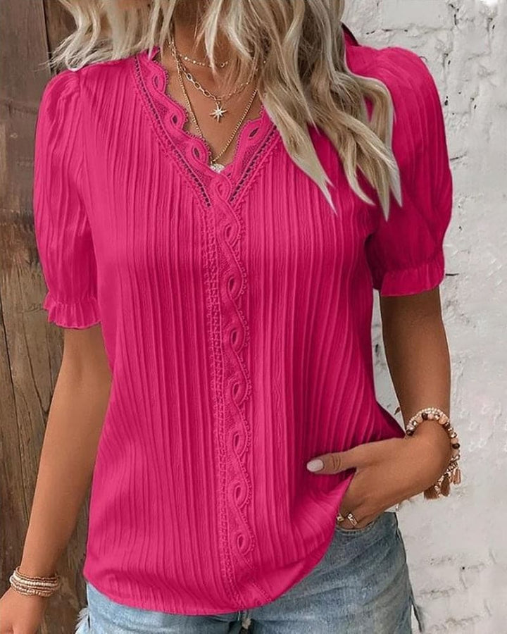 Blusa elegante de encaje con escote en V