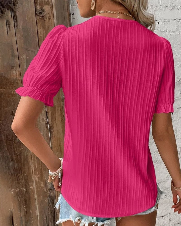 Blusa elegante de encaje con escote en V