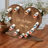 Scatola regalo in legno a forma di cuore con lettera d'amore e contanti