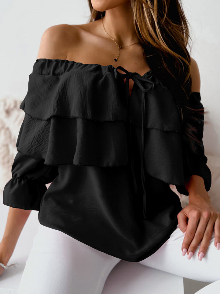 Blouse with boat neckline and long sleeves with ruffles
